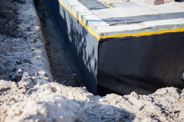 Professional Emergency Waterproofing technician working in East Rockaway, NY